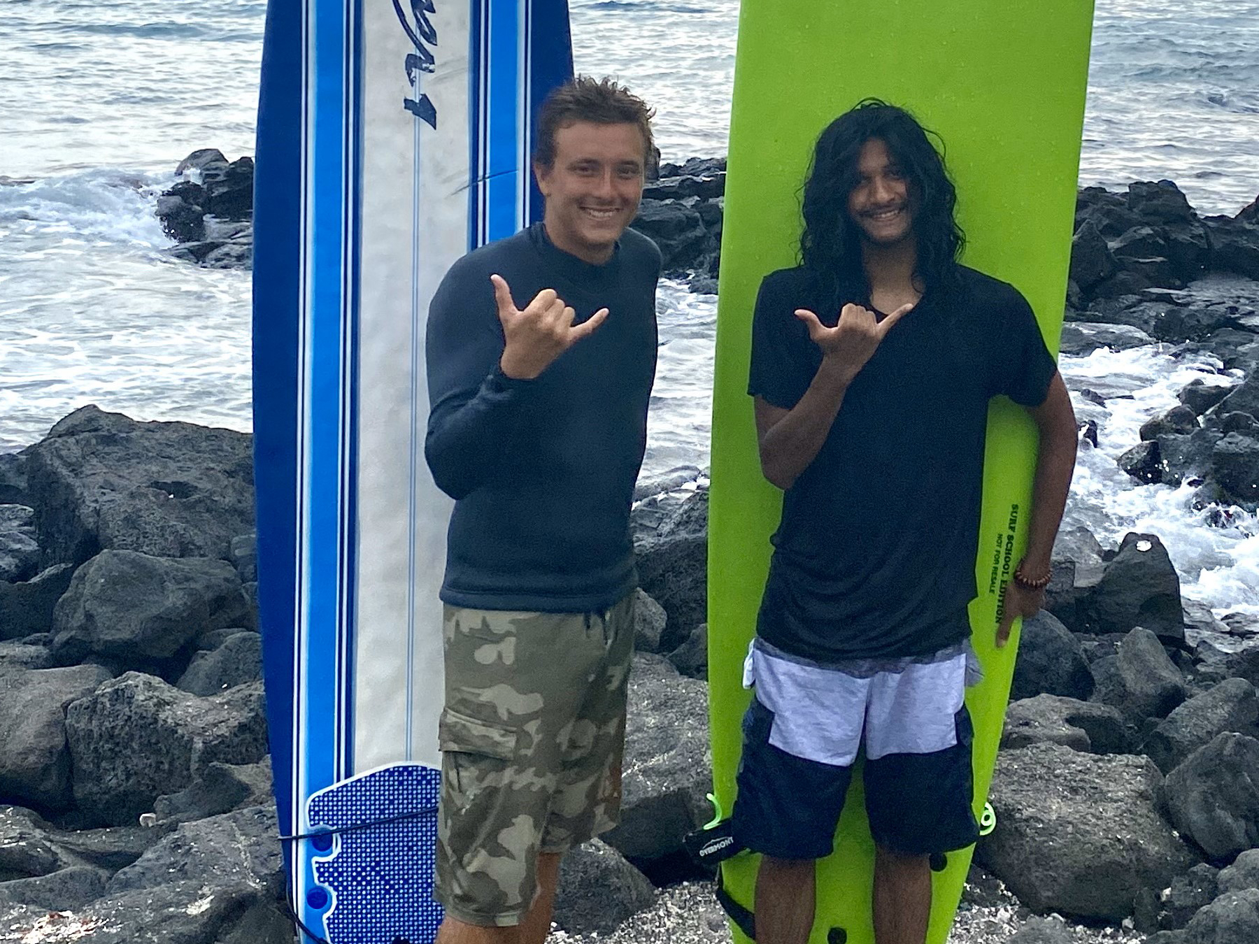 Surf instructor Kaleo with one student