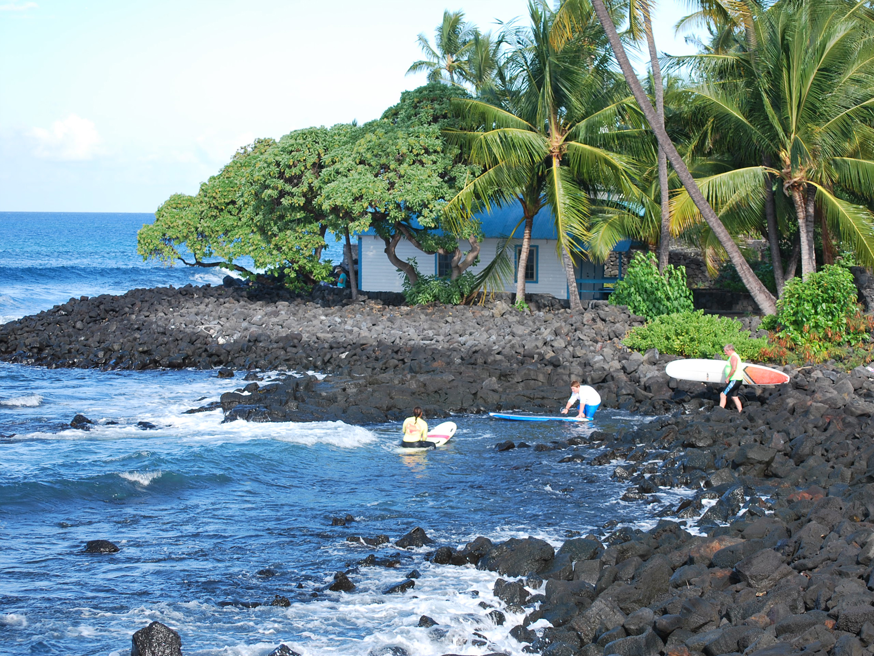 Kahaluu surfers entering the water